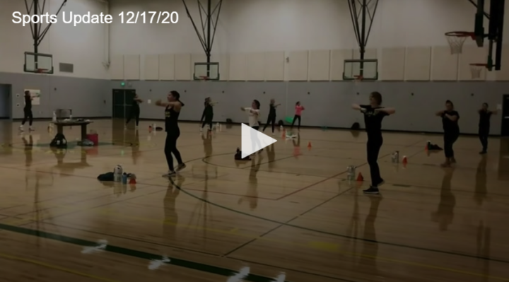 gym full of people standing and doing stretches