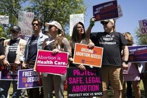 Arizona governor signs bill repealing 1864 abortion ban