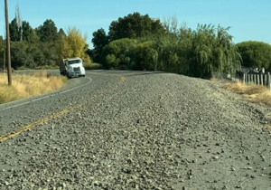 Semi accidently drops gravel over roadway in Eltopia